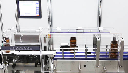 Dynamic Checkweighing of open bottles by HC-A Dynamic Checkweighing of open bottles by HC-A